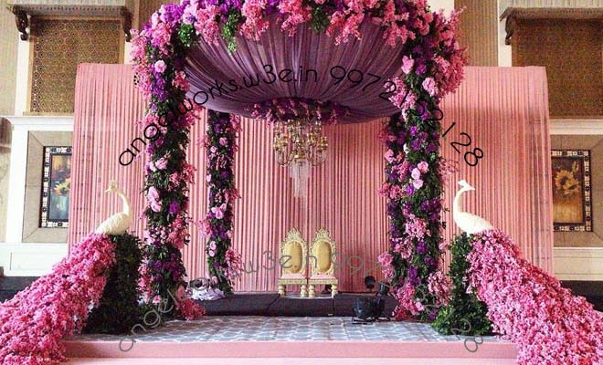 theme mandap decorations in bangalore with peacock theme and chandeliers